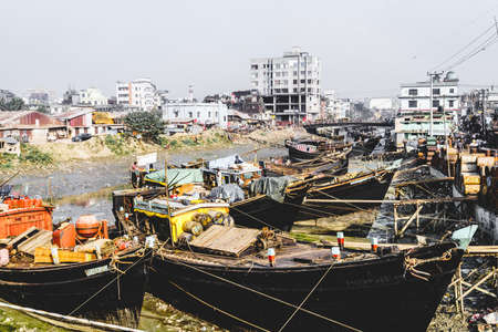 Chittagong, Bangladesh, December 23, 2017: Fishng boats in a canal near fish market in Chittagong, Bangladeshのeditorial素材