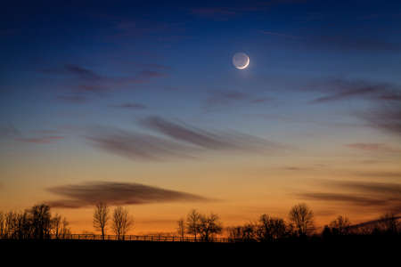 Scenic view of young crescent moon over rural Kentuckyの写真素材