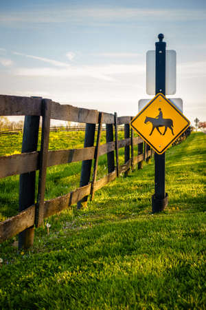 Equestrian crossing road sign by a horse farm in Central Kentuckyの写真素材