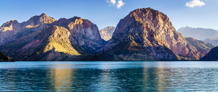 Scenic view of Iskanderkul - an alpine lake in the mountains of Tajikistanの写真素材