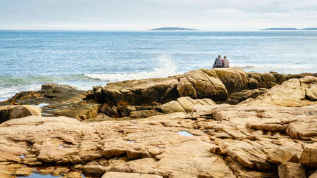 Acadia National Park, ME, October 5, 2020: Elderly couple enjoying a beautiful day on the Atlantic coast of Acadia National Parkのeditorial素材