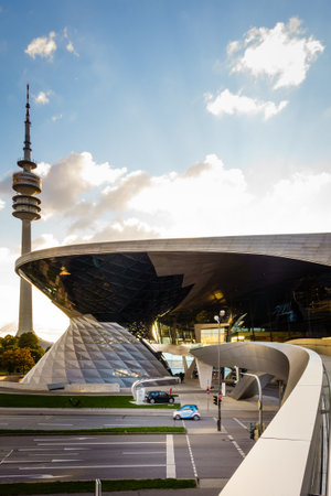 Munich, Germany, September 29, 2015: BMW showroom with Olympic television tower in the background in Munich, Germanyのeditorial素材