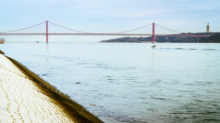 Scenic view of 25th April Bridge and the Tagus River in Lisbon, Portugal