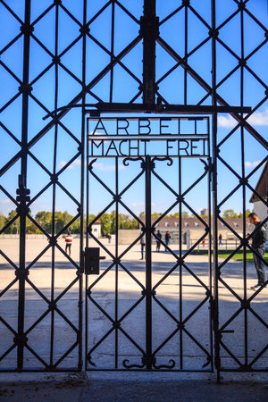 Dachau, Germany, September 30, 2015: Infamous gate of Dachau Concentration Camp. The inscription...