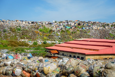 Lagos, Nigeria, November 22, 2019: People are living and picking through garbage at a waste disposal site in Lagos, Nigeriaのeditorial素材