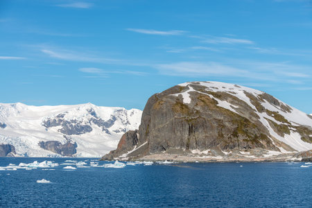 Antarctic landscape with iceberg at sea