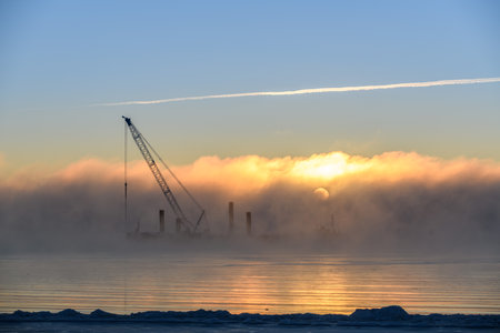 Construction Marine offshore works. Dam building, crane, barge, dredger. Breakwater construction.の写真素材