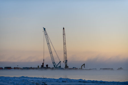 Construction Marine offshore works. Dam building, crane, barge, dredger. Breakwater construction.の写真素材