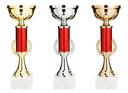 Gold, silver and bronze winners trophy cup isolated on white backgroundの写真素材