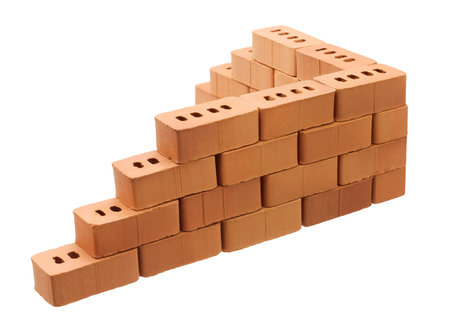 Corner of brick wall isolated on white backgroundの写真素材