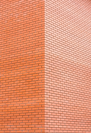 Dirty red brick corner backgroundの写真素材