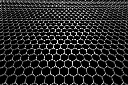 Steel grid with hexagonal holes and reflection on black background in perspective viewの写真素材