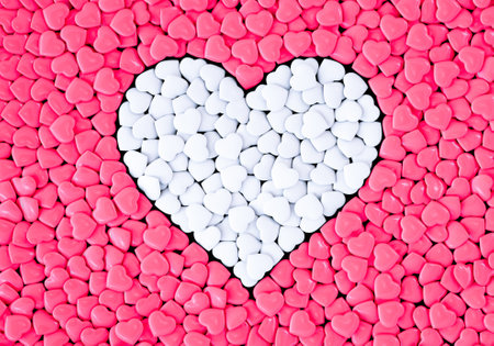 Background from pink and white hearts with a heart shape in the center. Valentines Day. 3D rendering.の写真素材