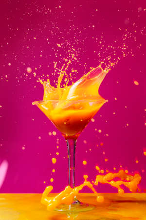 Pop art colorful splash oh a glassの写真素材