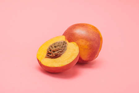 Peach with a pink backgroundの写真素材
