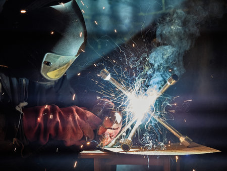 Welder working with automatic welding