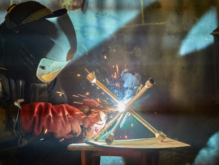 Welder working with automatic welding