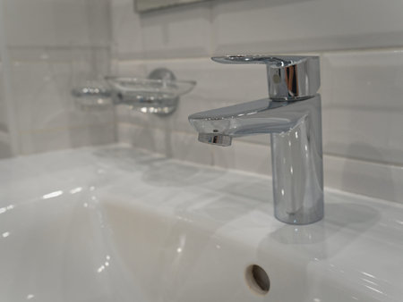 The taps in the bathroom are installed in the wall.