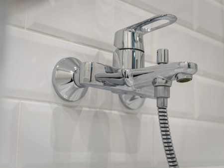 The taps in the bathroom are installed in the wall.の写真素材