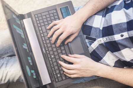 the man on the couch with a laptopの写真素材