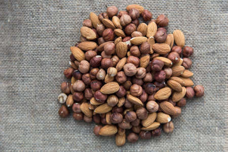 pile of nuts on burlap clothの写真素材