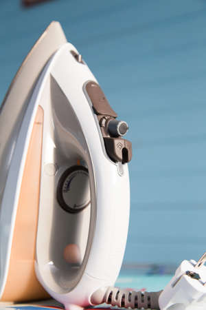 Iron close up on ironing boardの写真素材