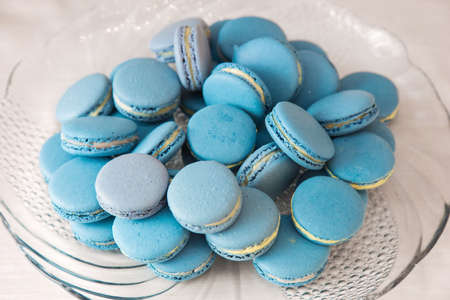 Tasty blue macarons on a plateの写真素材