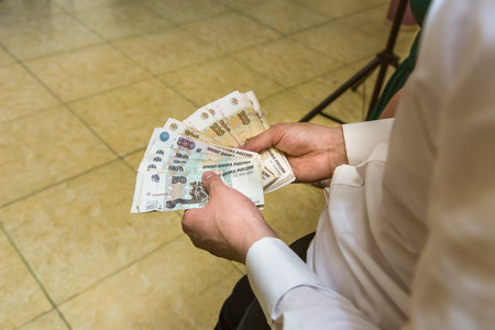 men's hands count the Russian money close up