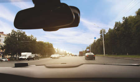 view from the car on the road in the city and trafficの写真素材