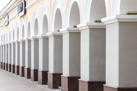 classic stone arched architecture of shopping arcadesの写真素材
