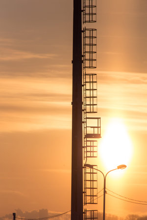 Mast lighting mantles at the stadium on a sunset background.の写真素材