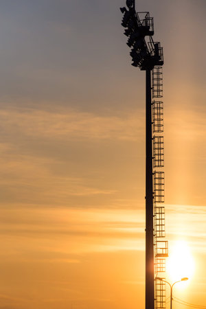 Mast lighting mantles at the stadium on a sunset background.の写真素材