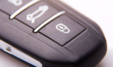 black car key with three buttons very close-up on a light background.の写真素材
