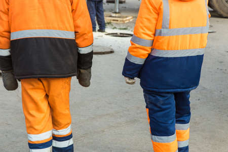 bright overalls of city service workers close up.の写真素材