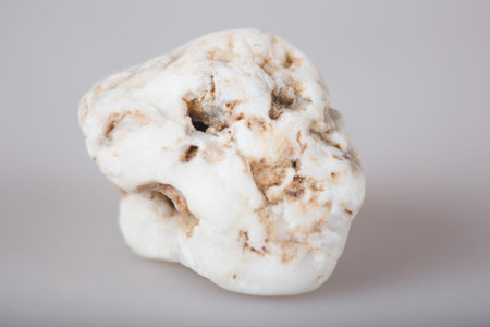 Three white stones on the white background closeup