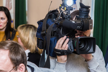 Video camera operator working with his equipment