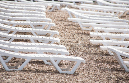 white sunbeds on the beach. Rest area on the shore.の写真素材