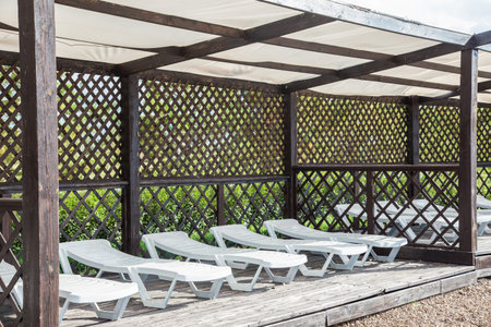 white sunbeds on the beach. Rest area on the shore.の写真素材