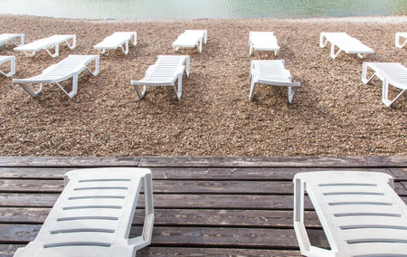 white sunbeds on the beach. Rest area on the shore.の写真素材