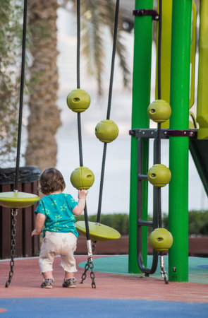 little child girl playing on the playground