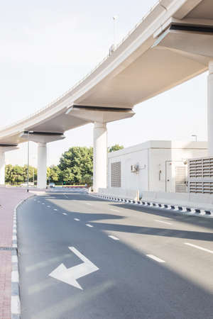 concrete subway overpass and city road under itの写真素材