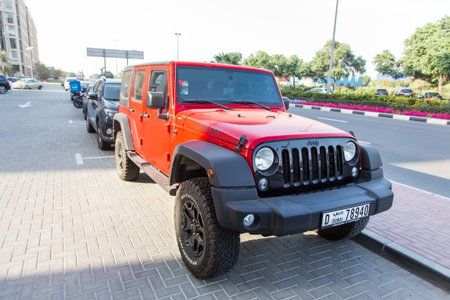Dubai, UAE February 19, 2018: orange Jeep in the parking lot