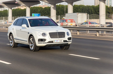 Dubai, UAE February 20, 2018: white Bentley rides on the road