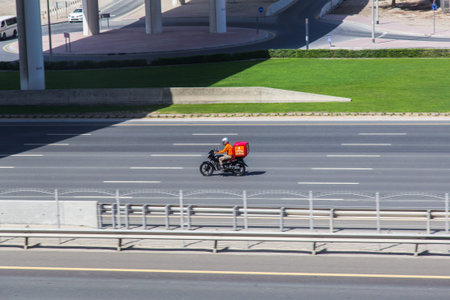 Dubai, UAE February 14, 2018: motorcyclist on the high-speed city highway in motion
