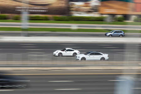 Dubai, UAE February 14, 2018: cars on the high-speed city highway in motionのeditorial素材