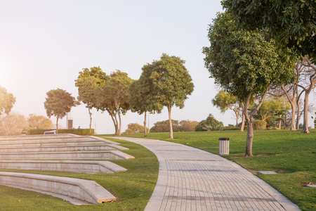 Beautiful panorama of green city park at dawn, trackの写真素材