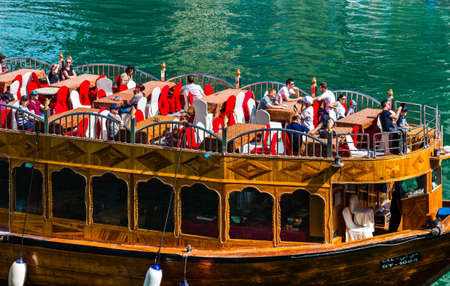 Dubai, UAE February 19, 2018: tourist wooden ship in Dubai Marina bay on a sunny summer dayのeditorial素材