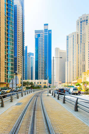 Dubai, UAE February 17, 2018: tramway on the background of roads and skyscrapers in Dubai Marinaのeditorial素材
