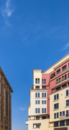classic multi-colored bright stone building against the blue skyの写真素材