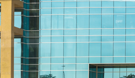 architectural geometric elements of the exterior of the building made of glass and concreteの写真素材